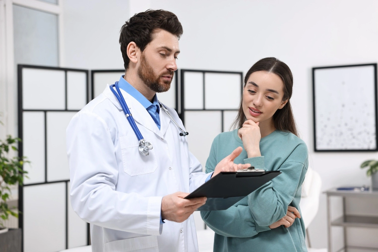 Doctor consulting a female patient during a check-up at Georgia Family Care clinic