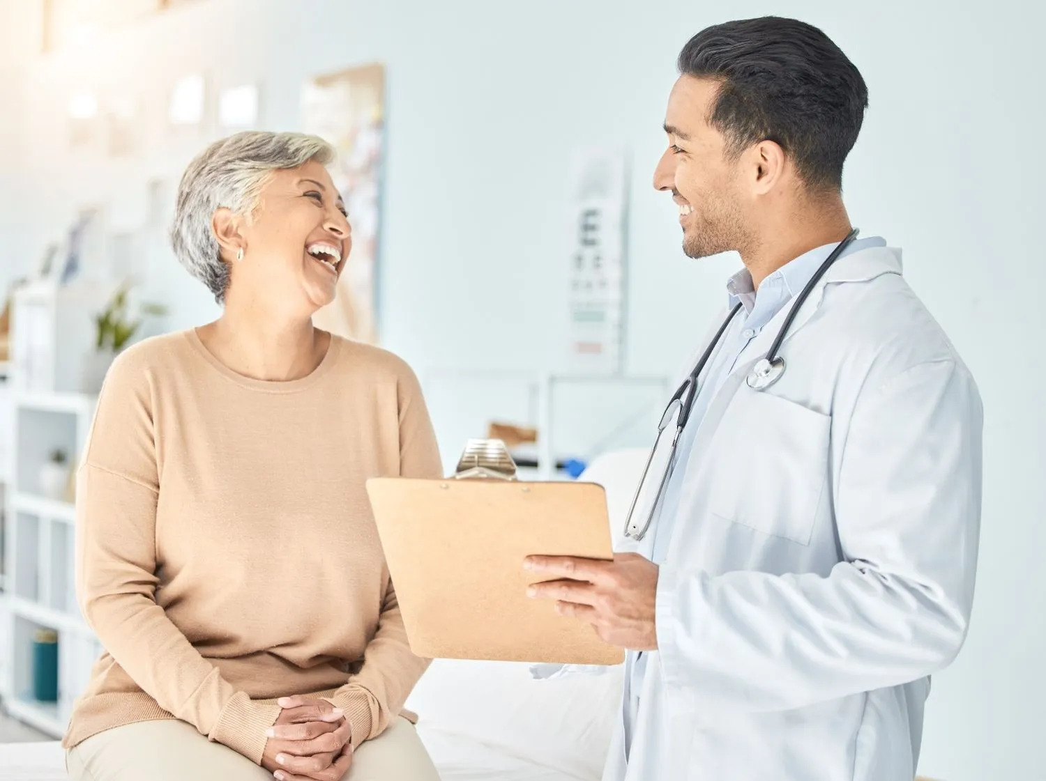 A senior woman smiling during a medical consultation with a doctor about Tirzepatide weight loss treatment, highlighting safe weight management options for older adults.