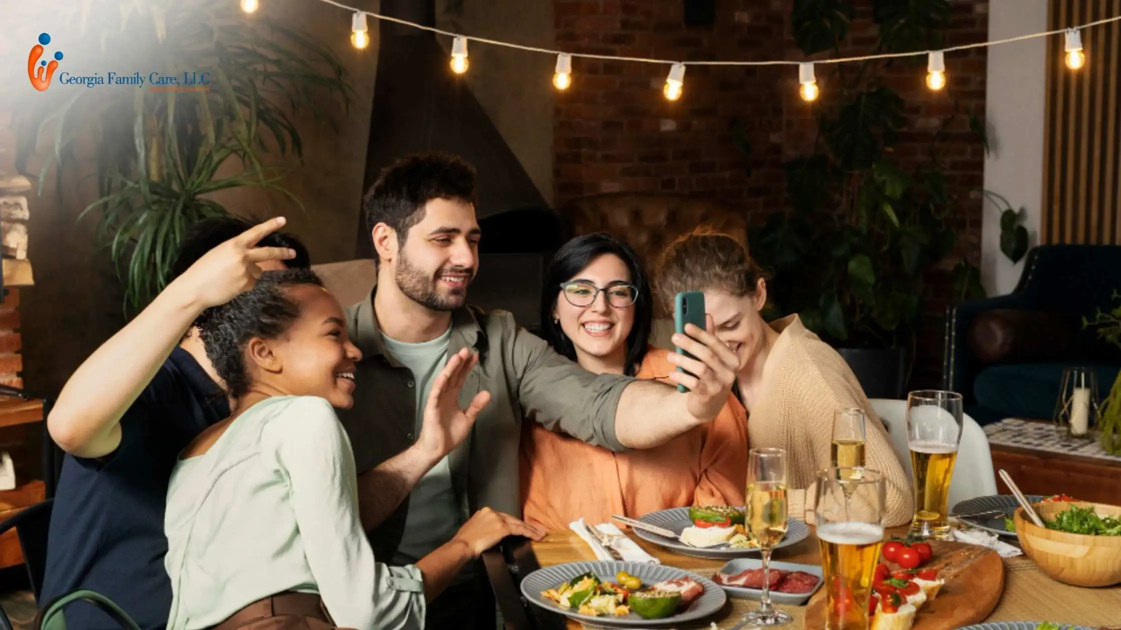 A family enjoying a Thanksgiving dinner together in Atlanta, smiling and taking a selfie around a festive table. Perfect example of togetherness during Thanksgiving in Atlanta, highlighting healthy celebration ideas and safe family gatherings this holiday season.