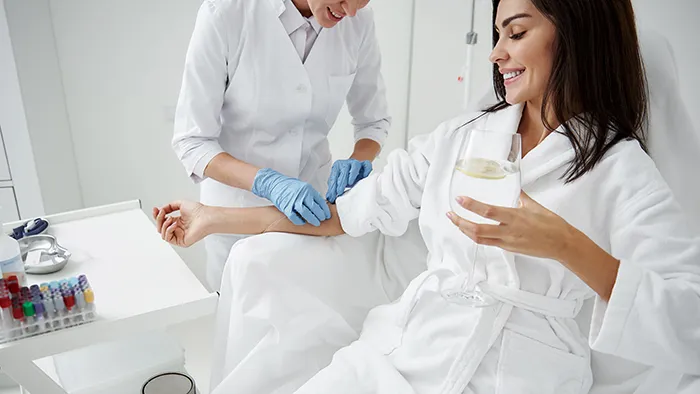 Patient receiving IV drip therapy treatment in Georgia clinic for hydration and wellness support<br />
